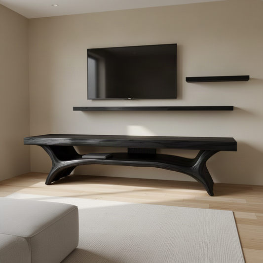 Solenne sculptural wood TV stand in Black finish with organic sculpted form and open storage shelf in a modern home