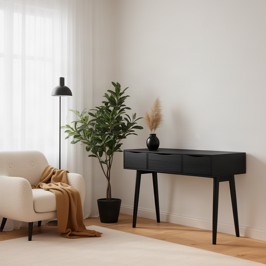 Mirello mid-century wood console table in black finish with three drawers in a light modern living room
