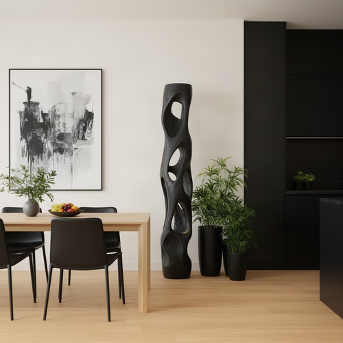Ambera sculptural wood floor lamp in Black with hollow carved openings, a statement piece beside a modern dining area