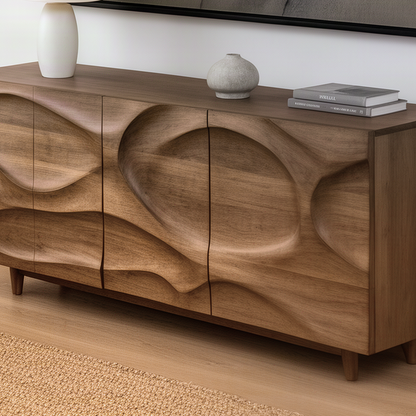 Close-up of the Ondessa sideboard showing hand-carved wave contours across the doors and natural wood grain