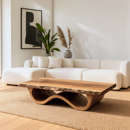 Tavira coffee table in Natural solid wood with a live-edge slab top on a flowing wave base in a bright living room