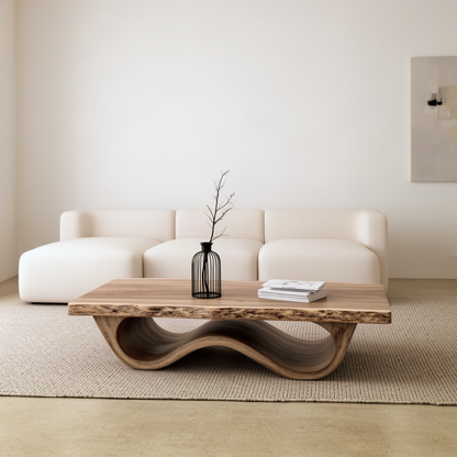 Front view of the Tavira live edge coffee table showing the wave base rising and dipping beneath the slab top