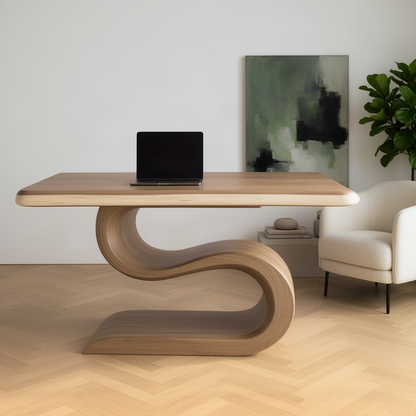 Serpina sculptural natural wood desk with laptop in a minimalist home office, curved pedestal base on herringbone floor