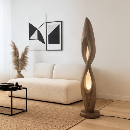 Flamara sculptural wood floor lamp in natural wood with twisting flame shape and warm glowing openings by a sofa