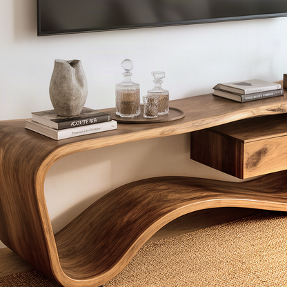 Close-up of the Hammora TV stand showing the rolled solid wood end, curved base and natural grain