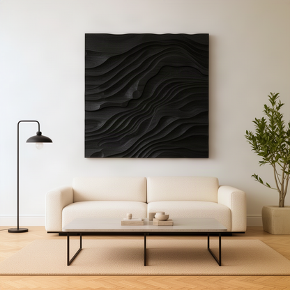 Sedora sculptural wood wall art in black finish, monochrome layered wave relief panel above a cream living room sofa